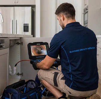 Clearing a blocked sink at a Greenwich property